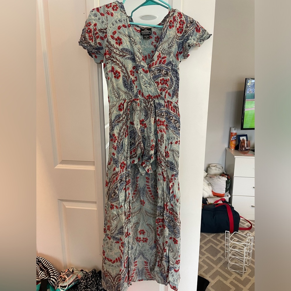 Beautiful patterned romper with flowy skirt. Size S.